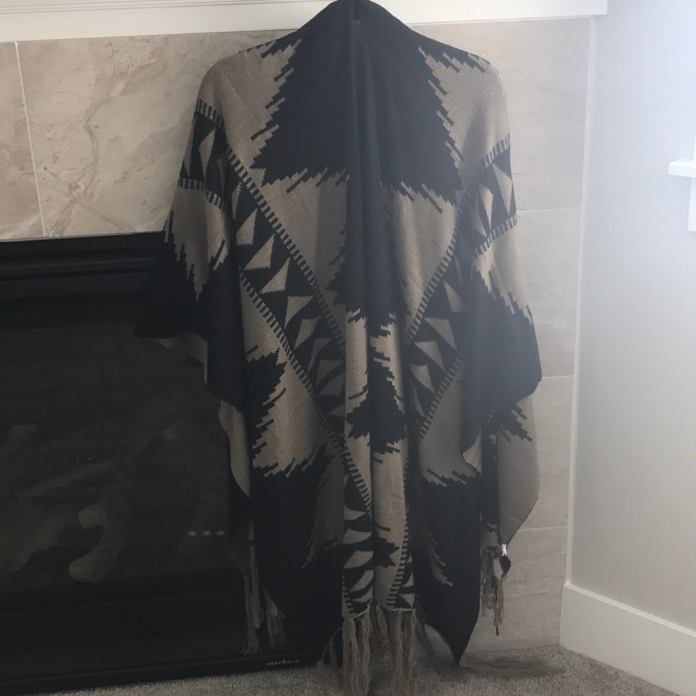 Poncho sweater with tassels